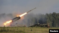 Russia -- A Russian TOS-1A multiple rocket launcher fires during the opening of the Army-2015 international military forum in Kubinka, outside Moscow, June 16, 2015