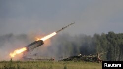 Russia -- A Russian TOS-1A multiple rocket launcher fires during the opening of the Army-2015 international military forum in Kubinka, outside Moscow, June 16, 2015