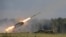 Russia -- A Russian TOS-1A multiple rocket launcher fires during the opening of the Army-2015 international military forum in Kubinka, outside Moscow, June 16, 2015