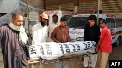 Volunteers handover the body of convicted hijacker to relatives in Hyderabad on May 28.