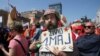 A Croatian man holds a sign declaring "Long Live May 1" during International Workers' Day celebrations in the capital Zagreb.
<br /><br />Photo by zoomzg for RFE/RL