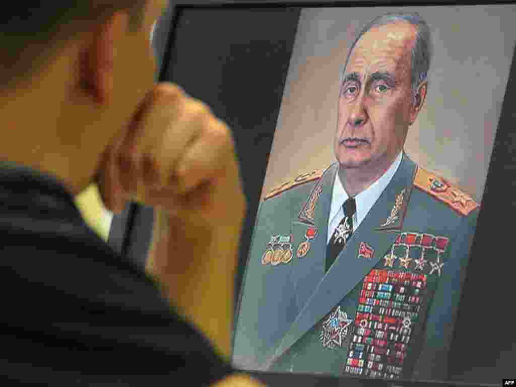A cartoon depicts Prime Minister Vladimir Putin as Leonid Brezhnev on a computer screen in Moscow. (Photo by Aleksandr Nemenov for AFP)