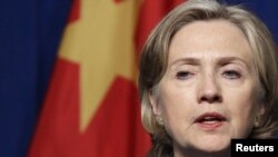 U.S. Secretary of State Hillary Clinton urged continued cooperation with Beijing, but highlighted China's troubling rights record.