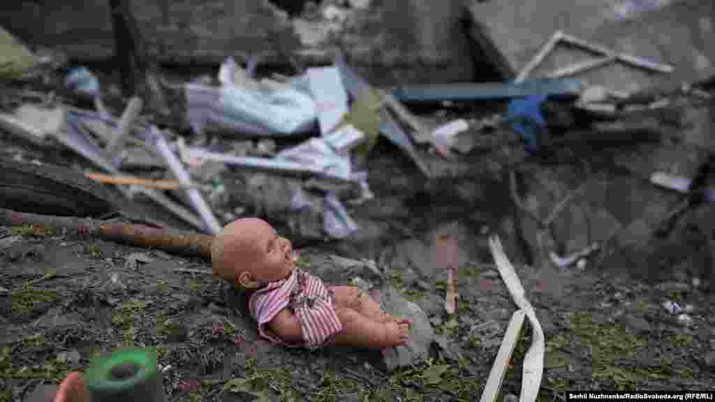 As RFE/RL captured images of the aftermath in Boryspil, the personal belongings of local residents were scattered across the scene, including a child’s toy.Following the attack, Kyiv Regional Governor Tymur Tkachenko said Russian forces were “again purposely striking" civilian sites and residential buildings.