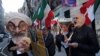 Protesters gather across the street as Iranian Foreign Affairs Minister Mohammad Zarif speaks at the Council on Foreign Relations in New York, April 23, 2018