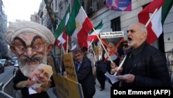 Protesters gather across the street as Iranian Foreign Affairs Minister Mohammad Zarif speaks at the Council on Foreign Relations in New York, April 23, 2018