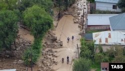 Наурызбай ауданының Қарғалы ықшамауданында болған селден кейінгі көрініс. Алматы, 23 шілде 2015 жыл.