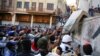 Iraqi demonstrators try to pull down concrete walls during the ongoing anti-government protests in Baghdad, Iraq November 24, 2019.