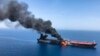 An oil tanker is on fire in the sea of Oman, June 13, 2019.