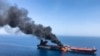 AT SEA -- An oil tanker is on fire in the sea of Oman, June 13, 2019.