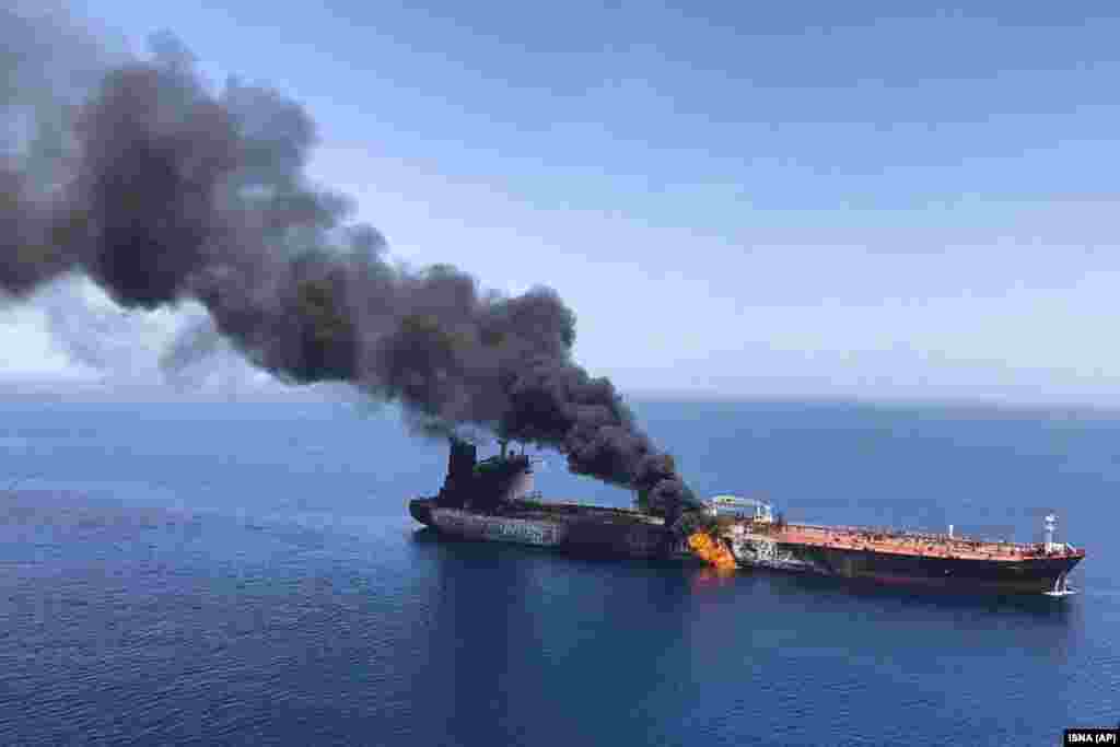 An oil tanker is seen on fire in the Sea of Oman on June 13. Two oil tankers near the strategic Strait of Hormuz were reportedly attacked, an assault that left one ablaze and adrift as sailors were evacuated from both vessels and the U.S. Navy rushed to assist amid heightened tensions between Washington and Tehran. (AP/ISNA)