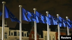 Belgium -- EU flags fly outside the European Commission headquarters in Brussels, October 30, 2014