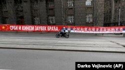 PHOTOGALLERY: Public Displays Of Affection? Chinese Signage In Serbia Sparks EU Ire