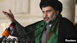 Muqtada al-Sadr delivers a sermon to worshippers during Friday Prayers at the Kufa Mosque near Najaf on May 10.