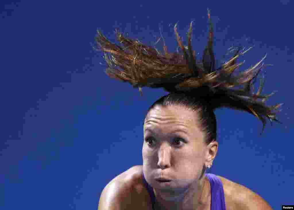 Jelena Jankovic of Serbia serves to Ayumi Morita of Japan during her women&#39;s singles match at the Australian Open tennis tournament in Melbourne on January 16. (Reuters/Brandon Malone)