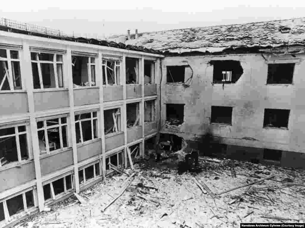 The scene of a bomb blast at RFE/RL's offices in Munich in February 1981.The effectiveness of RFE/RL was evidenced by multiple attacks on its staff and facilities. In 1981, a bombing reportedly paid for by Romania’s communist ruler, Nicolae Ceausescu, and arranged by Ilich Ramirez Sanchez, the notorious Venezuelan Marxist militant known as “Carlos the Jackal,” shattered a corner of RFE/RL’s Munich headquarters, injuring several staff inside.