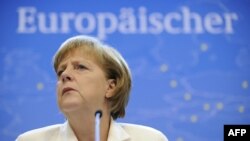 Angela Merkel la o conferință de presă în a doua zi a summitului Uniunii Europene, Bruxelles, iunie 2012.