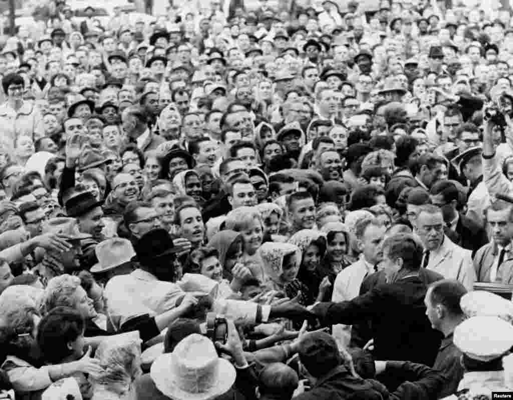 President John F. Kennedy greets a large crowd at a political rally in Fort Worth, Texas on the morning of November 22, 1963.