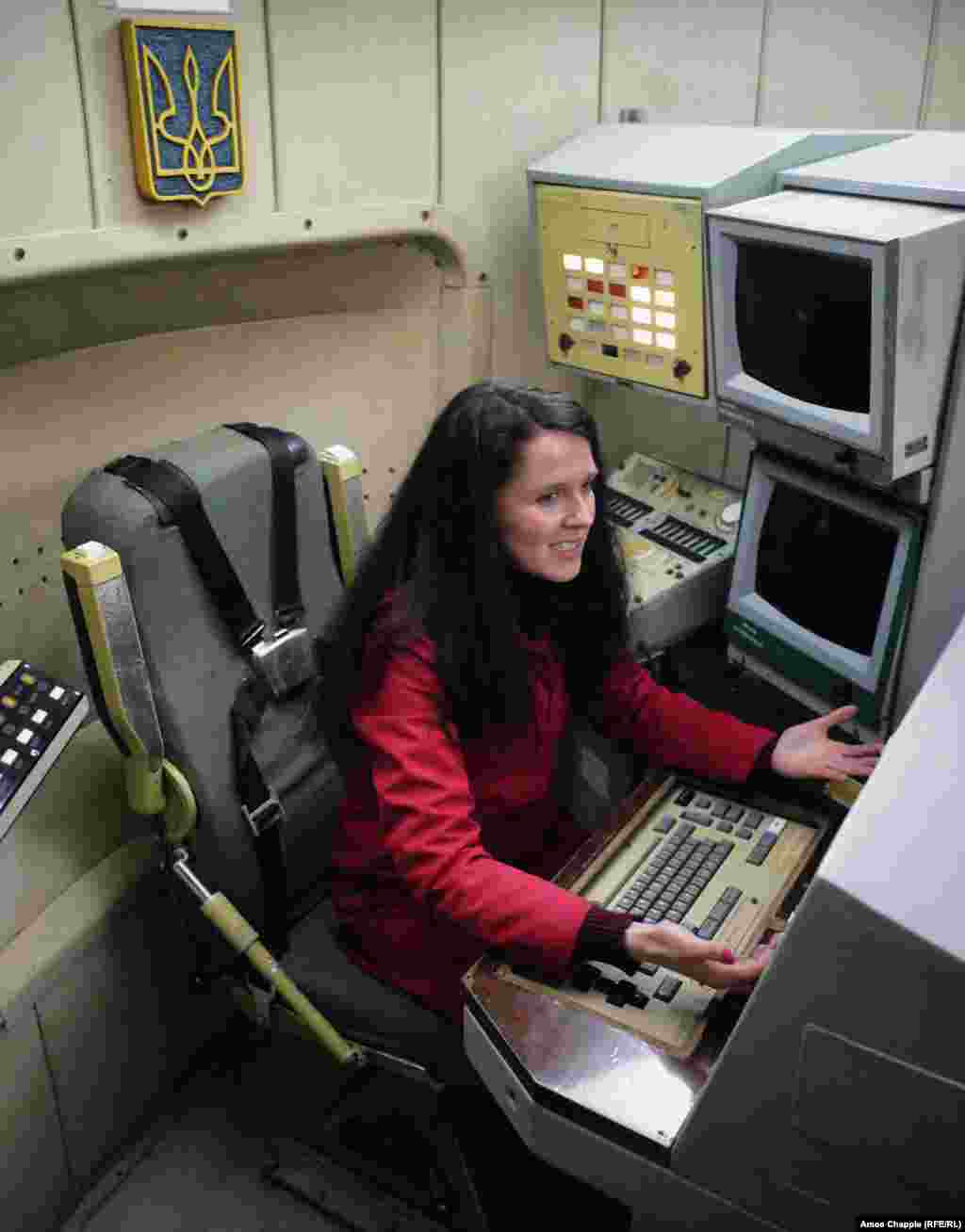 Local tour guide Olena Smerychevska (who works professionally as Elena Smerichevskaya) sitting at one of the two desks with access to&nbsp;the launch buttons.