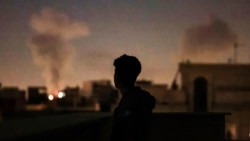 A plume of smoke rises after a strike on Tehran on March 4.