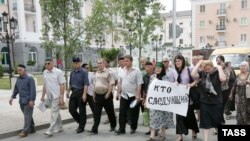 Funeral procession for slain human rights activist Natalia Estemirova.