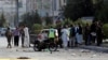 Afghan security forces inspect the site of a suicide attack in Kabul on September 9.