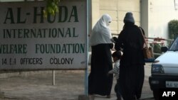 Pakistani students arrive at Al-Huda Institute, one of the most high-profile female seminaries in Multan on December 7.