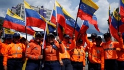 Government supporters participate in a women's march, in Caracas
