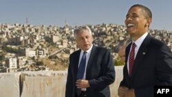 U.S. President Barack Obama (right) shares a laugh with U.S. Senator Chuck Hagel as they tour the citadel of the Jordanian capital Amman. (file photo)