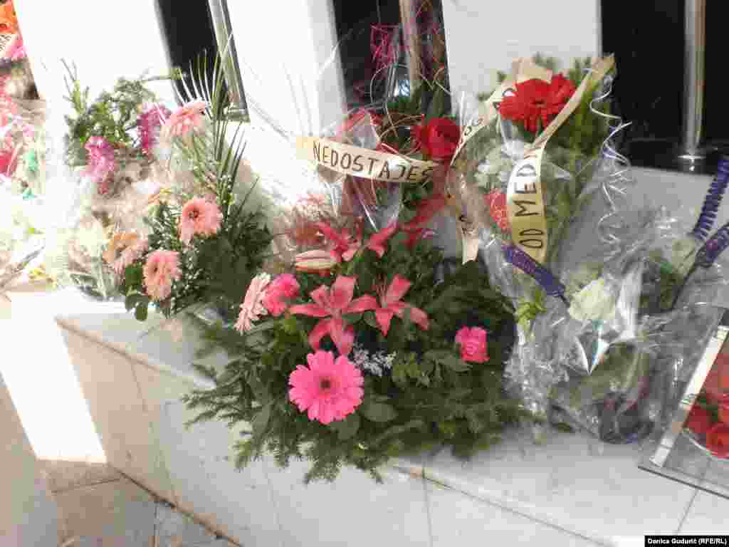 Laying flowers at the memorial for murdered civilians in Strpce 1993.