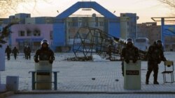 Kazakhstan -- Riot police cordon off a square in the town of Zhanaozen, 18Dec2011