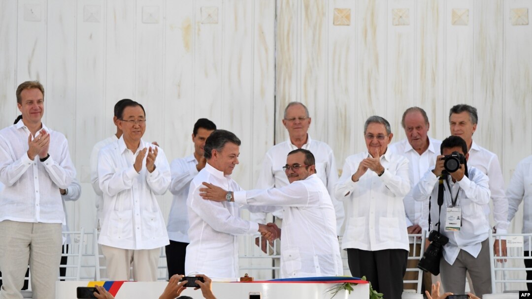 President Juan Manuel Santos i lider FARC-a Timoleon Jimenez 