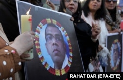 People attend a vigil for a Sri Lankan worker who was lynched by a mob over allegations of blasphemy in Lahore in December.