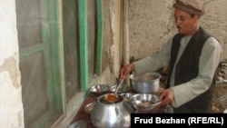 Guests of the campaign meeting are served shurwa, Afghan soup with meat and vegetables that's eaten with bread.