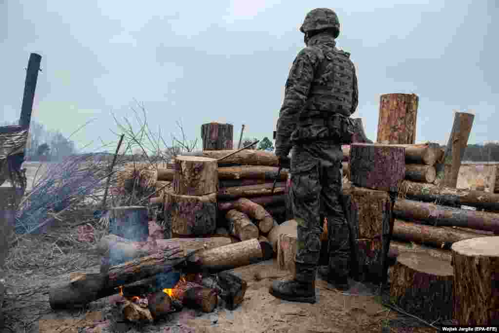 A Polish soldier keeps watch on the Belarusian border with Poland, which has come under increasing migratory pressure in recent months.