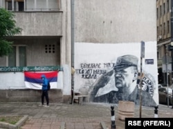 In central Belgrade, a mural to wartime Bosnian Serb Army commander Ratko Mladic adorns the facade of a building, underscoring the fact that for many Serbs he remains a hero.