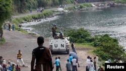 United Nations peacekeepers stand on top of their armored vehicle as they patrol near Lake Kivu in the Democratic Republic of Congo. (file photo)
