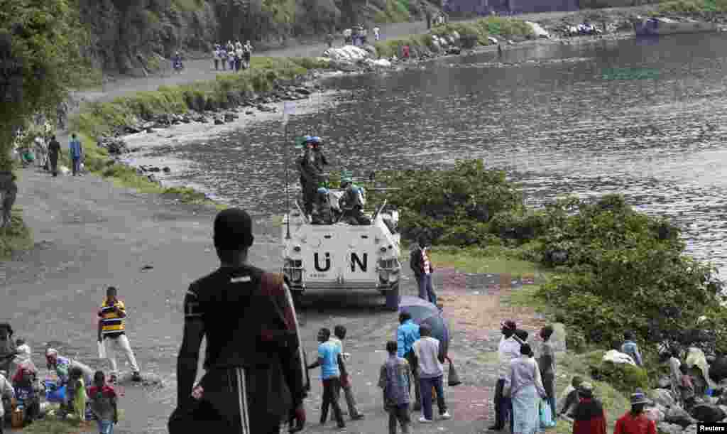 UN peacekeepers stand atop their armored vehicle on a patrol near Lake Kivu in the Democratic Republic of Congo. The United Nations&#39; failure to have any significant impact on security in the war-torn country has prompted a new draft resolution to allow UN troops to use proactive force.&nbsp;