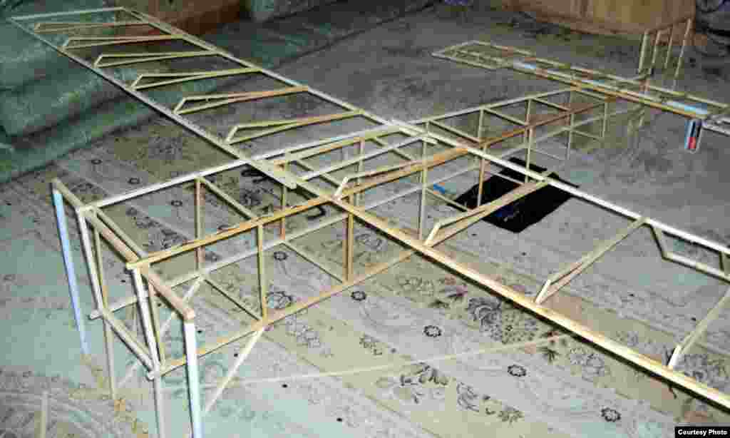 Afghanistan - An Afghan makes drone design plane in southern Afghanistan, 29Mar2012