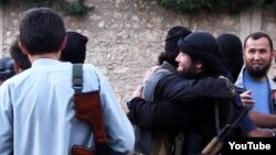 Скриншот размещенного в Сети видео о казахских "джихадистах" в Сирии. 