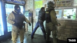 Russian police carry out an operation on December 30 as they crack down on illegal immigration in the wake of the suicide bombings in Volgograd.