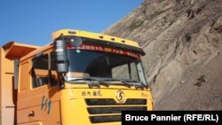 We passed several major road construction sites in the mountains on the way to the city of Naryn. Large construction vehicles with Chinese writing on them were at every site.