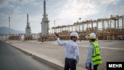 Two Iranian engineers in Hengam gas condensate refinery in the Qeshm island.