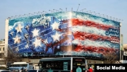 دیوارنگارۀ تازۀ میدان ولیعصر تهران، با اشاره‌ به عواقب «هدف‌ قرار دادن» هواپیمابر آمریکا