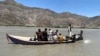 Rescuers search for survivors of a sunken boat in the Mohmand Dara district of Nangarhar Province on June 1.
