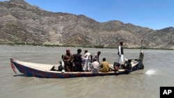 Rescuers search for survivors of a sunken boat in the Mohmand Dara district of Nangarhar Province on June 1.