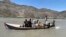 Rescuers search for survivors of a sunken boat in the Mohmand Dara district of Nangarhar Province on June 1.