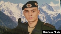 The Russian military says Ilya Gorbunov, 19, died when a tank he was driving rolled off a bridge. His sister says that a soldier from her brother's unit said Ilya died after being locked in a tank and suffocating.