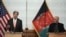 U.S. Secretary of State John Kerry (left) and Afghan President Ashraf Ghani take part in a press conference at Dilkusha Palace in Kabul on April 9. 