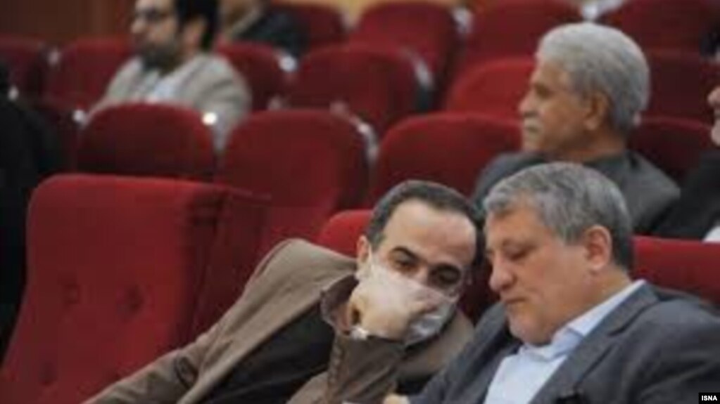 Mohsen Hashemi, Chairman of Tehran City Council, and Mojtaba Rahmanzadeh, Mayor of District 13 of Tehran who has been diagnosed with coronavirus speaking at a meeting of the Council on February 18. 